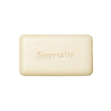 Nécessaire front packaging of the exfoliant bar highlighting fragrance-free benefit