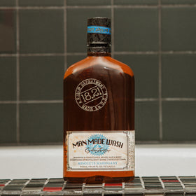 18.21 Man Made label close-up with scent notes for premium barbershop aroma