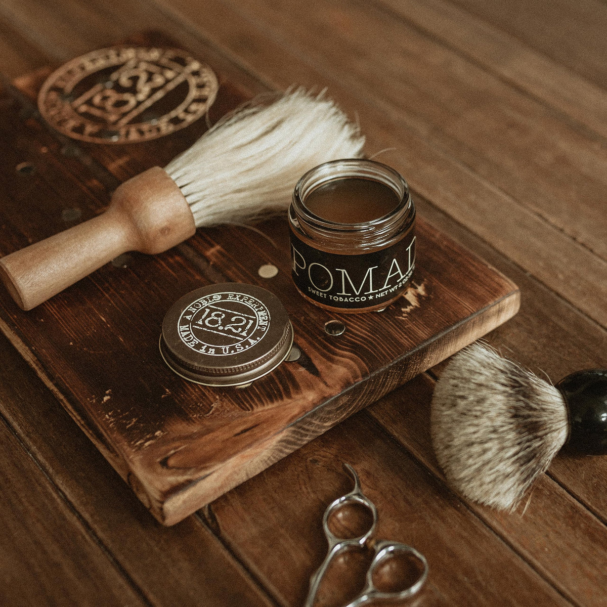 18.21 Man Made beside coin for scale highlighting the portable 2 oz size