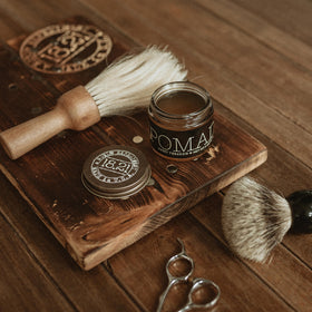 18.21 Man Made beside coin for scale highlighting the portable 2 oz size