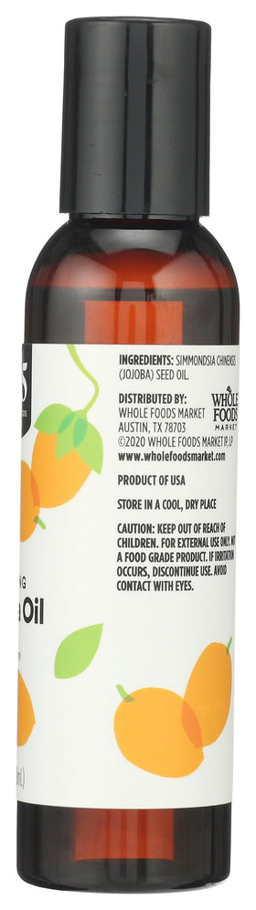 365 by Whole Foods Market rubbing oil into forearm showing quick absorption benefit