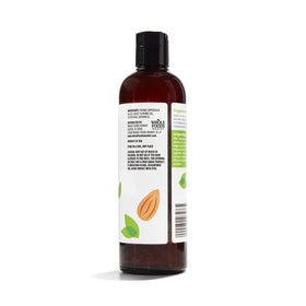 close-up pour of 365 almond oil texture demonstrating smooth absorption benefit