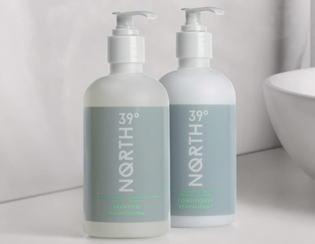 39° North bottles held in hand showing 8.5oz travel-friendly size and convenience