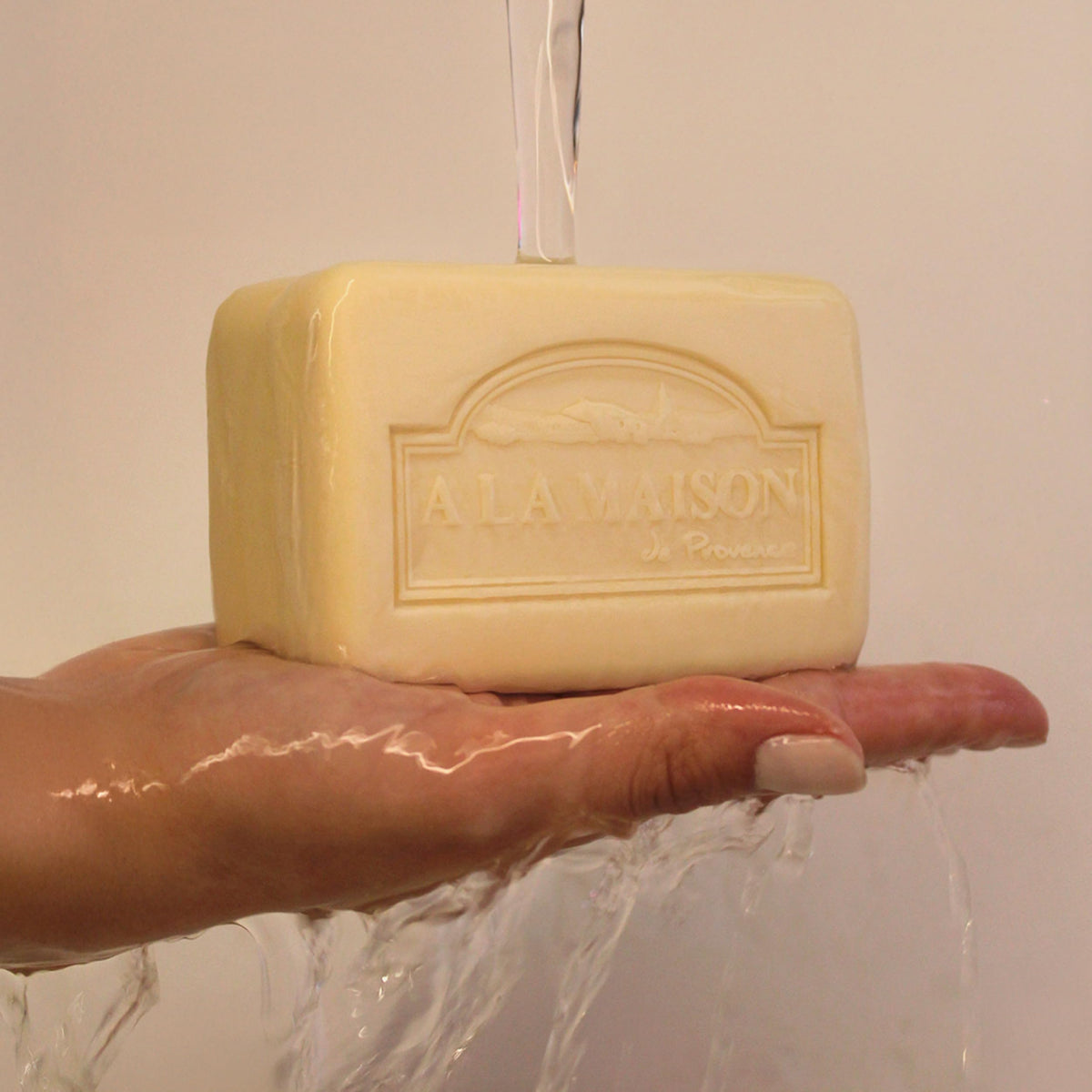 A LA MAISON bar on shower shelf, showing practical everyday use convenience