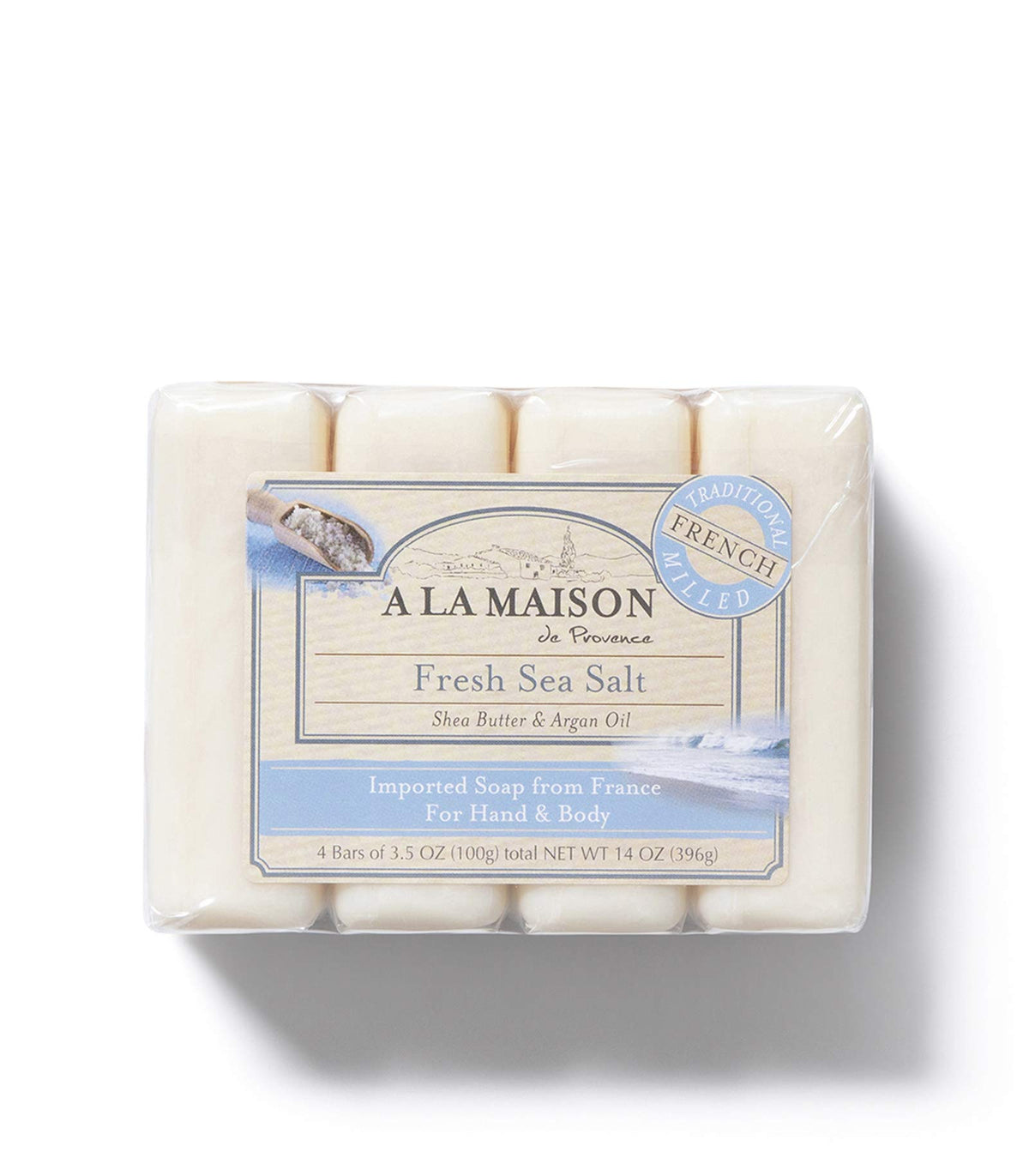 A LA MAISON bar in hand producing foam to show gentle cleansing benefit