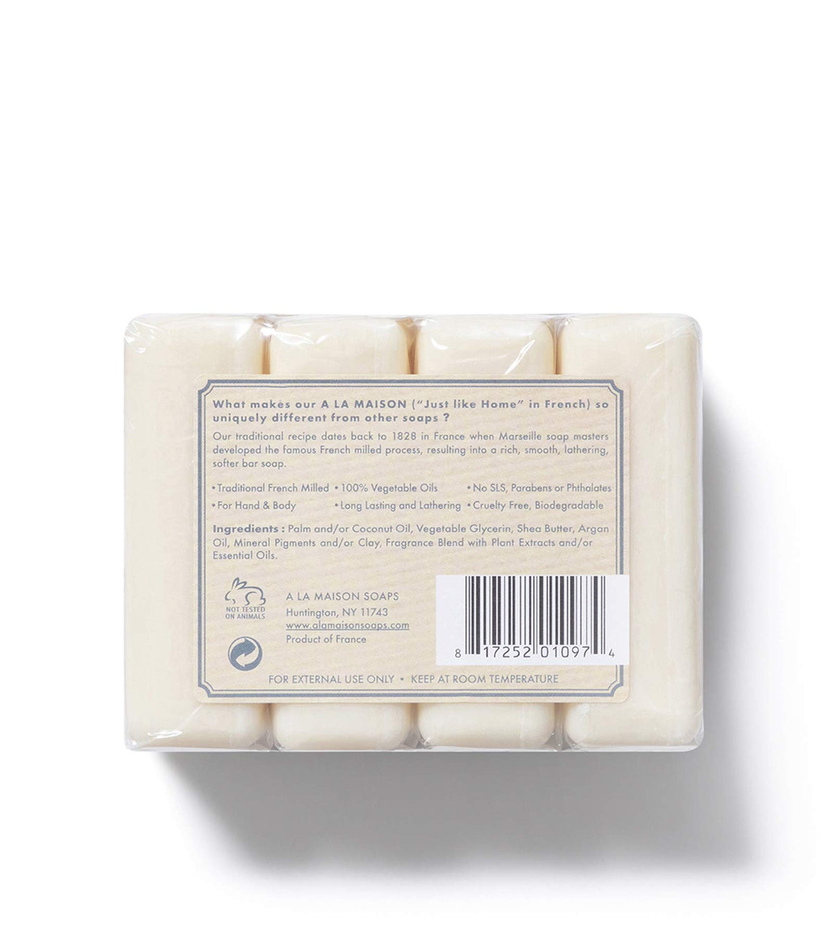 A LA MAISON soap beside ruler to illustrate 3.5 oz size and travel convenience