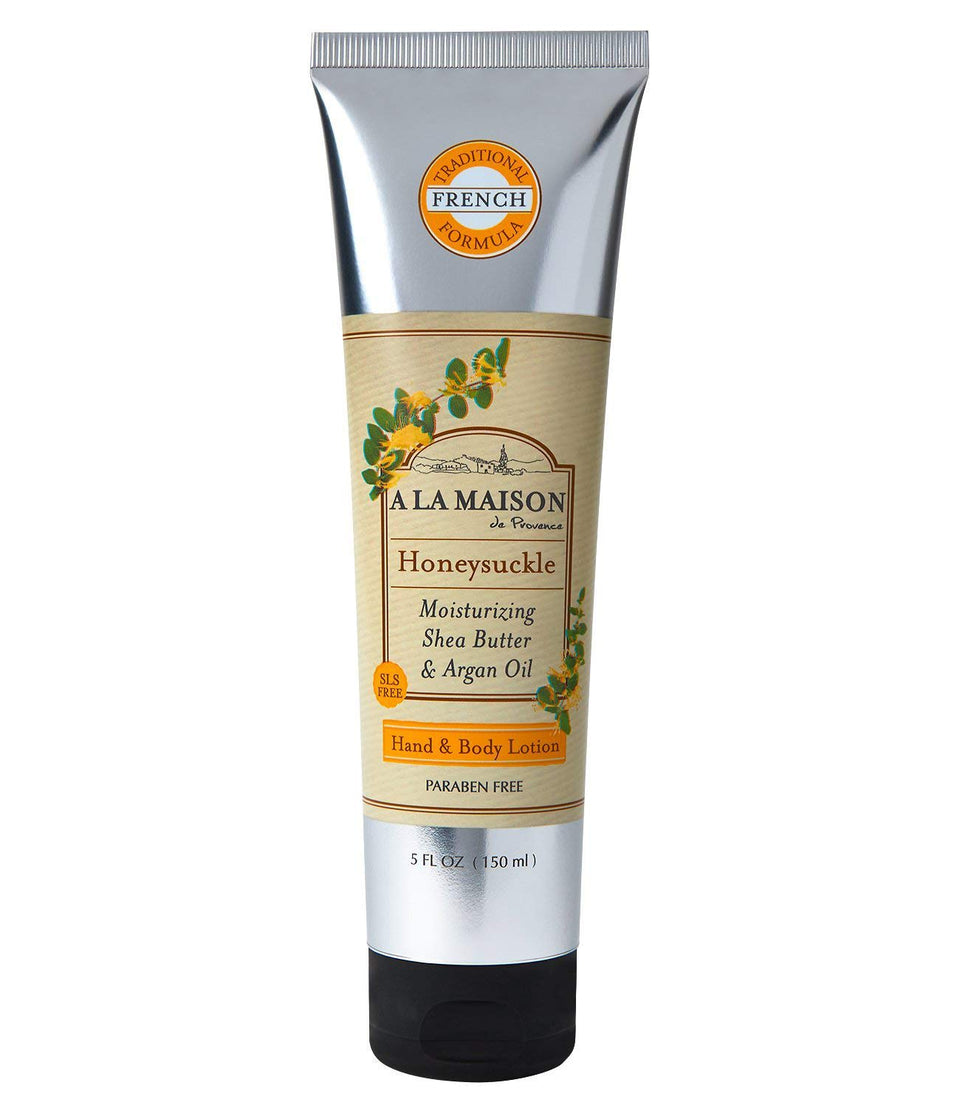 A LA MAISON honeysuckle lotion bottle front shows elegant packaging and quick-absorbing hydration