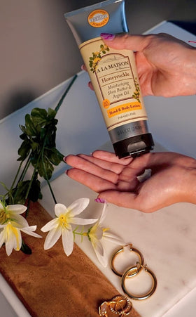 A LA MAISON honeysuckle dispensing pump in use demonstrating easy application and non-greasy feel