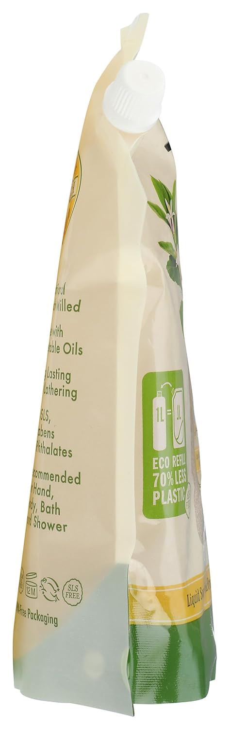 Pouring A LA MAISON lemon refill into a dispenser to show mess-free refill benefit
