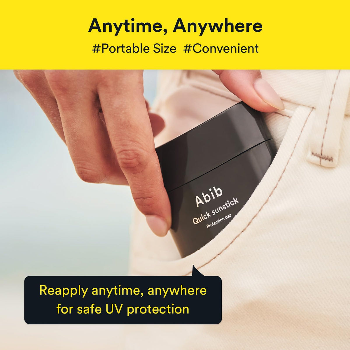 Abib sunstick next to beach bag illustrating travel-ready sun care