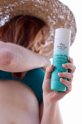 Absolutely Natural in beach bag lifestyle showing on-the-go sun care