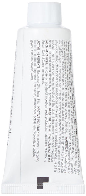 Adult Acnomel cream swatch close-up showing tinted texture, helps conceal redness