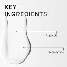 Acure bottles in hand to show true 8 fl oz scale
