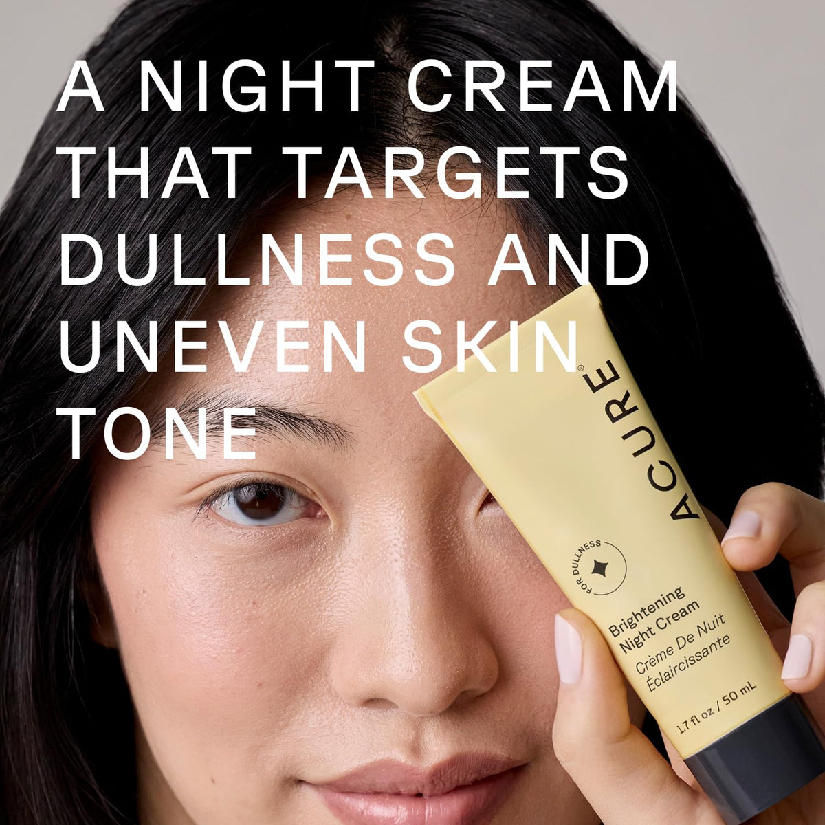 Acure open jar top view revealing smooth night cream consistency