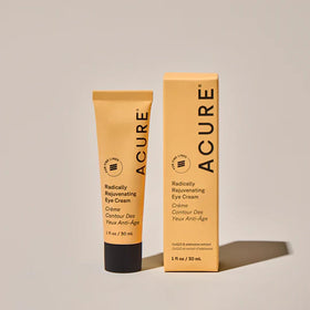 Acure eye cream next to coin for size comparison and travel-friendly benefit