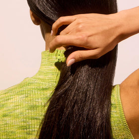 Acure shampoo lather texture demonstrating gentle, lightweight foam