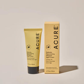 Applying Acure night cream to cheek demonstrating hydration and smoothing benefit