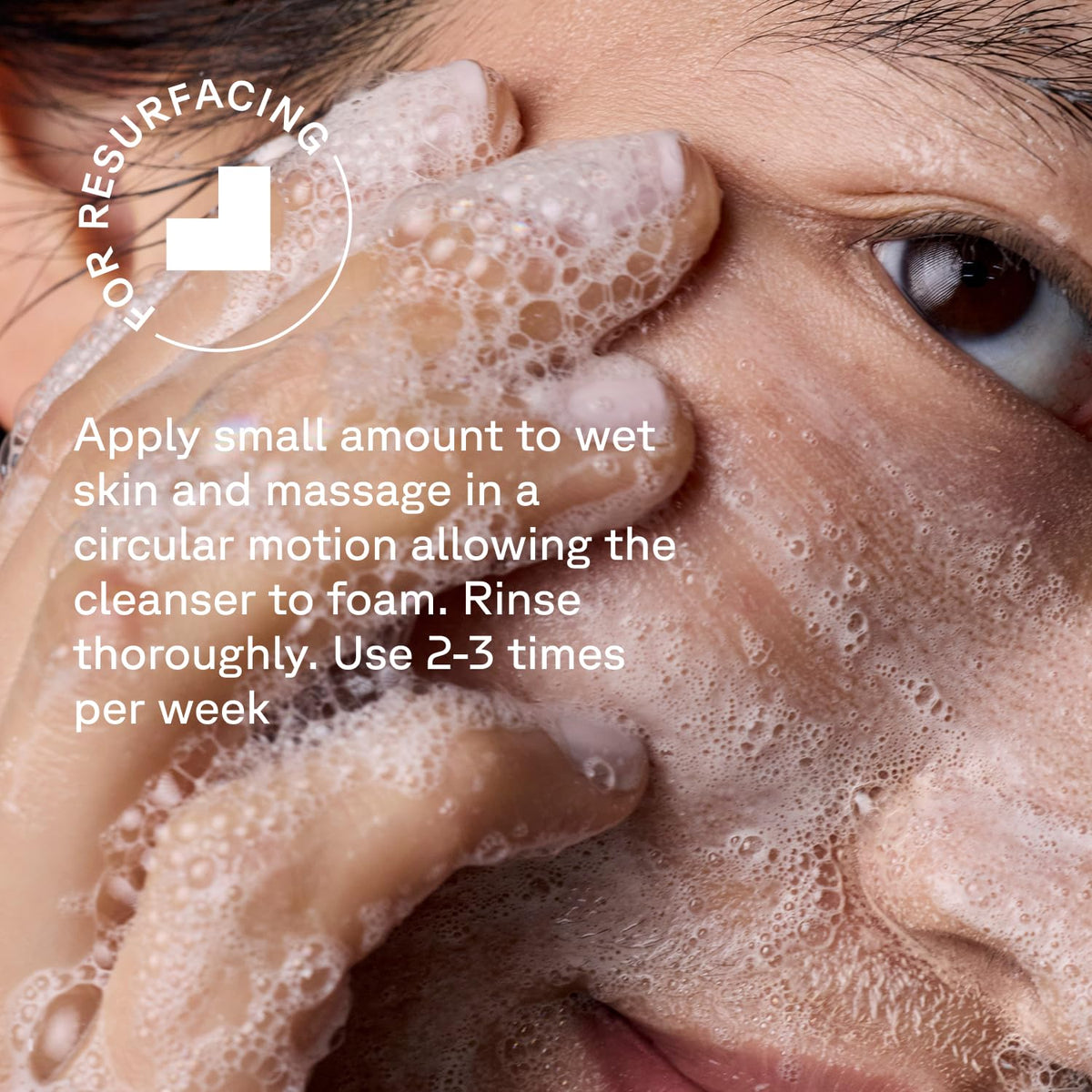 Acure bottle next to hand for clear size and scale reference