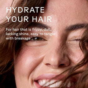 Acure creamy conditioner texture close-up showing smooth spreadability benefit