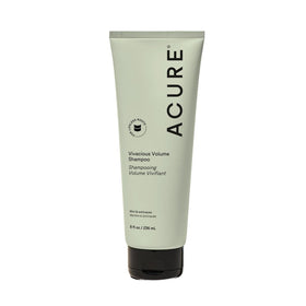 Acure bottle front view showing label and volumizing benefit