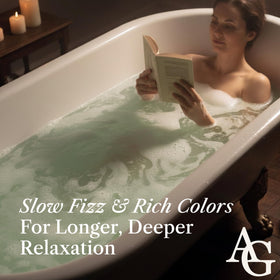 ADELEGOURDAIN bath bomb next to hand indicating 200g scale for extended use benefit