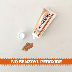 Applying Adult Acnomel to fingertip for targeted spot treatment and precision benefit