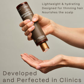 Advanced Trichology bottle on bathroom shelf showing everyday scalp care routine