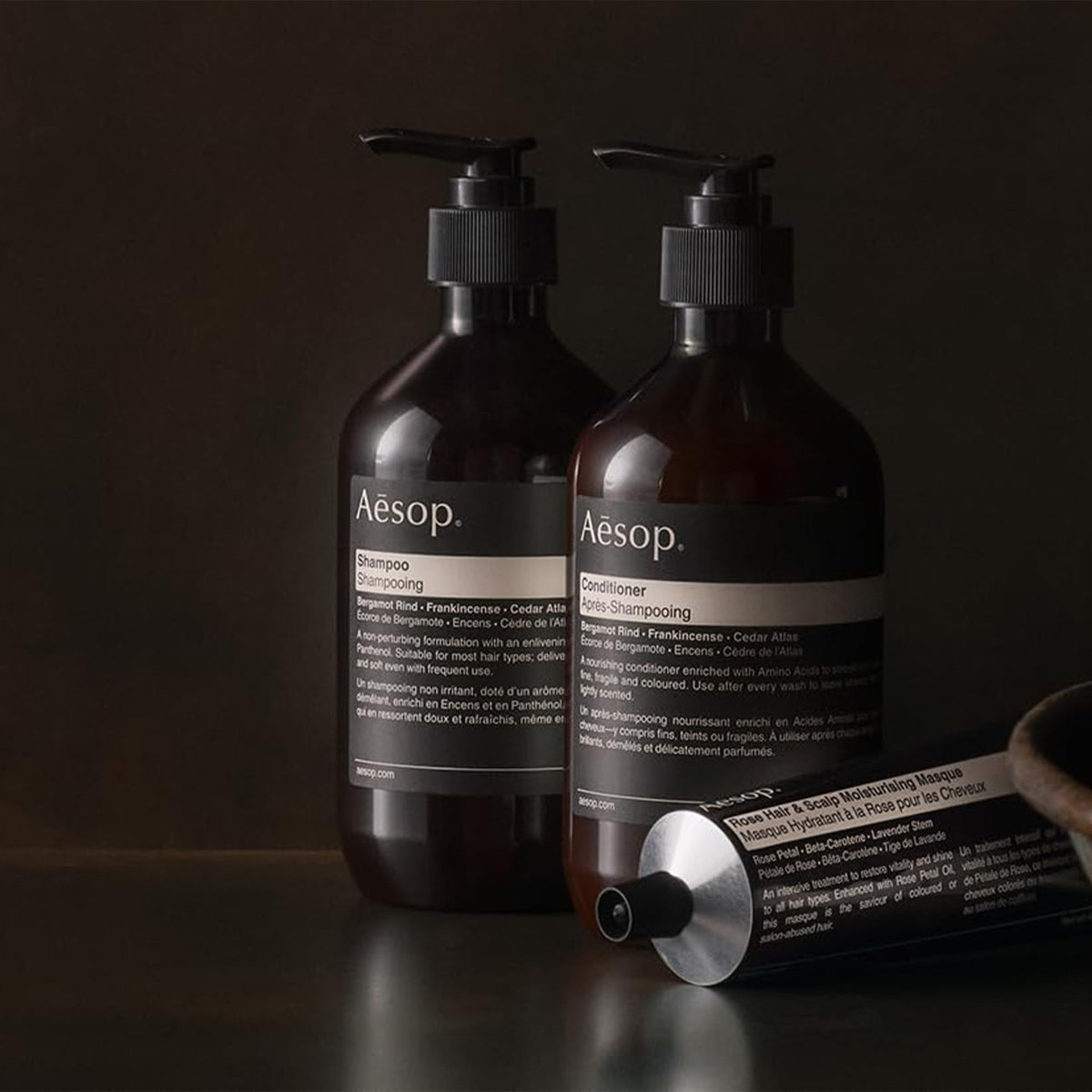 Aesop conditioner being applied in shower for better detangling benefit