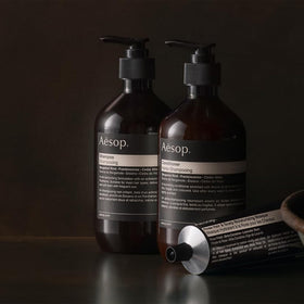 Aesop conditioner being applied in shower for better detangling benefit