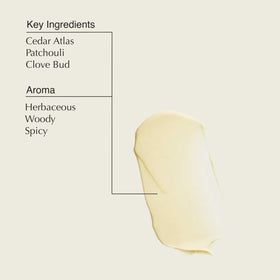 Hand scooping Aesop balm demonstrating smooth spreadability and hydration