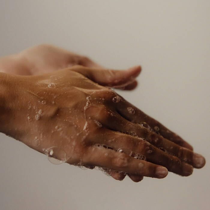 Aesop hand balm spread on skin showing fast absorption and lasting hydration