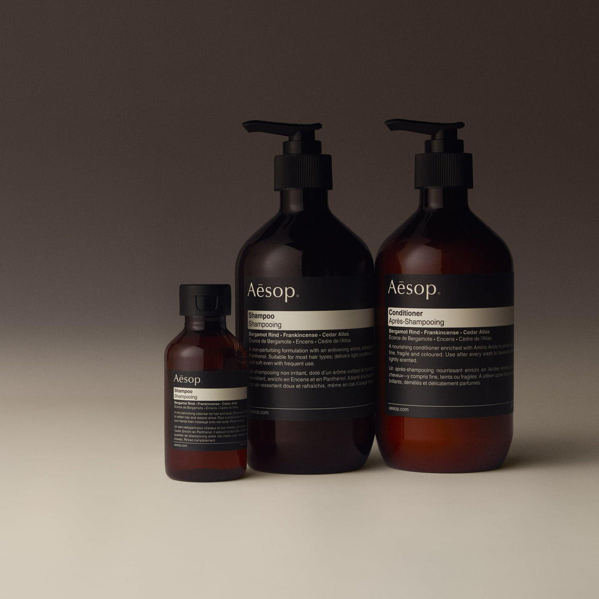 Aesop squeezing shampoo into palm to show easy dispensing and controlled use benefit