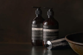 Aesop bergamot and frankincense ingredients staged to show natural fragrance benefit