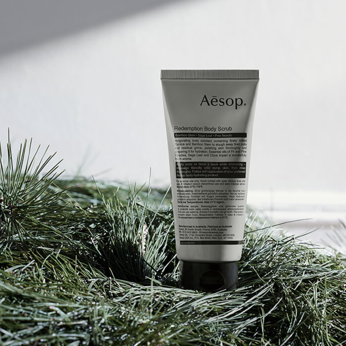 Aesop Redemption Body Scrub with sage leaf and pine needle ingredients highlighting purifying botanicals