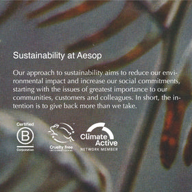 Aesop Redemption Body Scrub in a bathroom setting evoking a refreshing spa-like cleansing experience