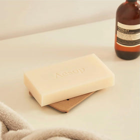 Aesop Refresh slab beside ruler showing 310g size and lasting use
