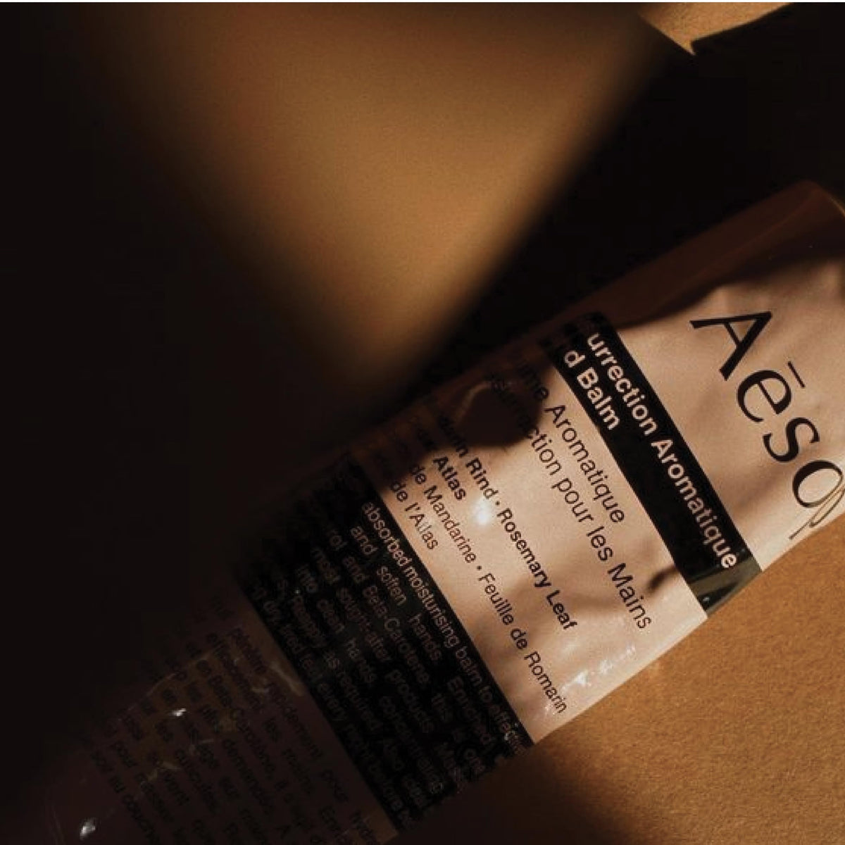 Aesop balm applied to hands demonstrating immediate softening and absorption