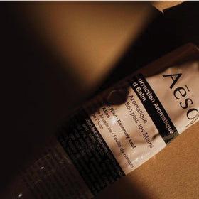 Aesop balm applied to hands demonstrating immediate softening and absorption