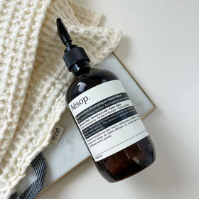 Aesop recycled plastic bottle emphasizing sustainable packaging and responsibility benefit