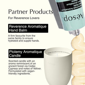 Aesop bottle next to a hand for scale showing the 500mL size and ergonomic pump