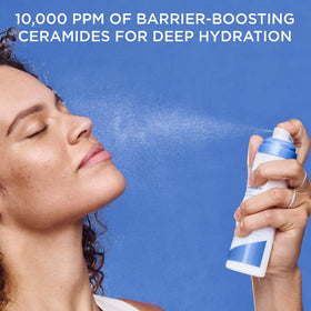 AESTURA bottle in hand for size comparison and easy portable hydration benefit