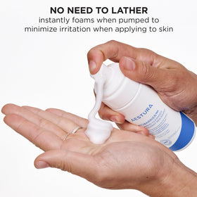 AESTURA 150ml bottle next to a ruler to show compact travel-friendly size