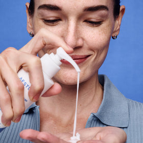 AESTURA moisturizer in hand to demonstrate size and travel-friendly benefit