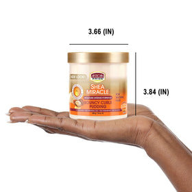 African Pride being applied to curly hair to define and reduce frizz
