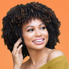 African Pride before and after on curls showing increased definition