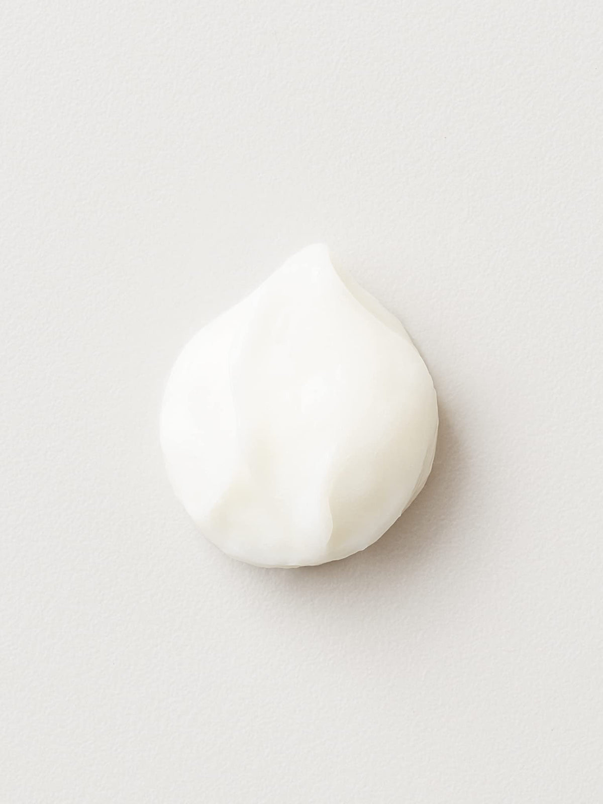 AG Care Beach Bomb cream texture closeup highlighting lightweight, non‑sticky formula and shine