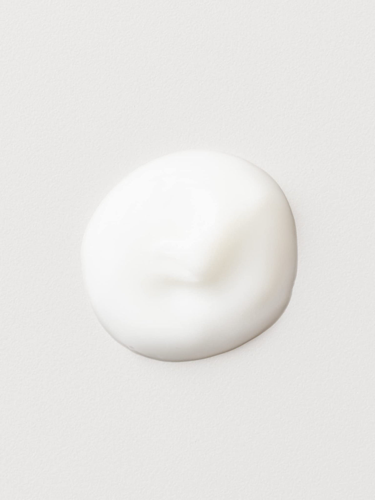 AG Care cream texture swirled on hand highlighting rich moisture and smooth slip