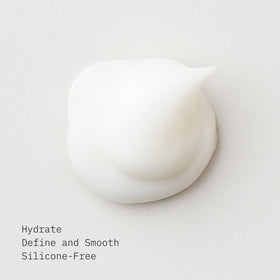 AG Care texture dispensed on hand, creamy conditioner offering smooth slip