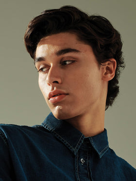 AG Care molding cream in use styling short hair to add volume and control frizz all day