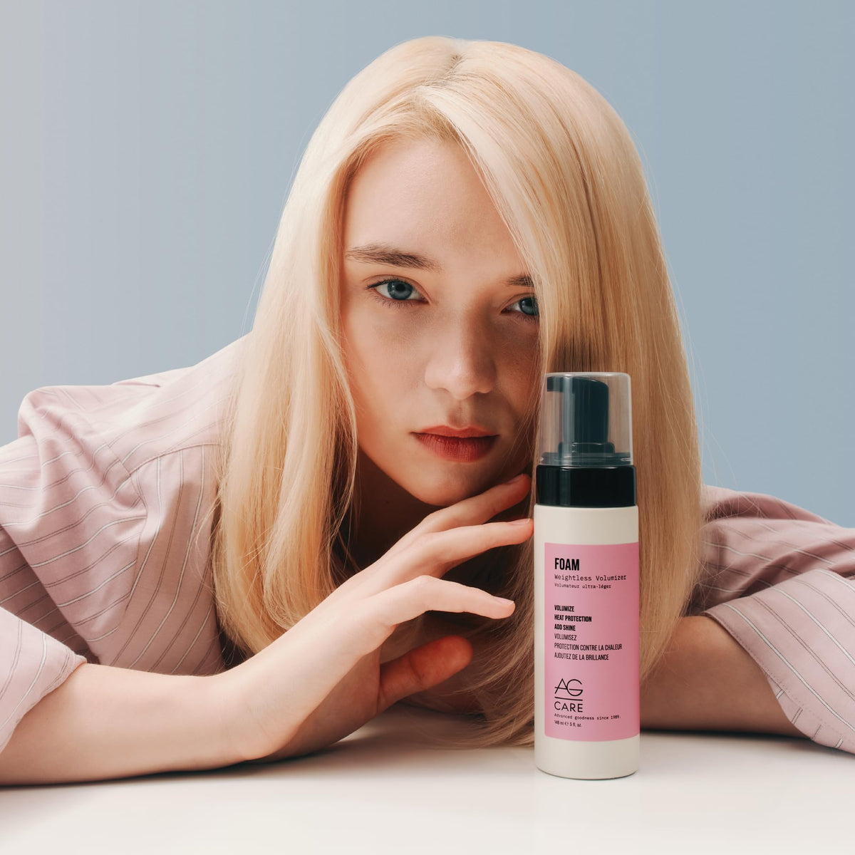 AG Care foam volumizer next to a 5 fl oz marker showing compact travel-friendly benefit